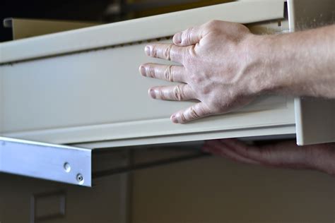 remove drawer from file cabinet